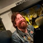 John Gallagher Jr. Instagram - Riding the spooky school bus back to the parking lot after surviving @halloweenatesp last night. I’m still smiling because the Phillies hadn’t lost yet. 📸 by @odyilliams