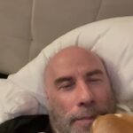 John Travolta Instagram - This is how Ben’s dog Peanut wakes me up.