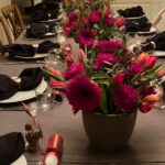 Julianna Margulies Instagram - I know, I start my table setting early because there’s so much to do with all the food, but my favorite part is setting the table and making it different every year. I went to our local flower shop to make my arrangements and they didn’t have a lot to choose from so I went with what they had. Also…. Chocolate turkeys by every plate is a staple. Happy pre thanksgiving!