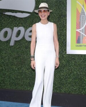 Julianna Margulies Instagram - What an amazing day @usopen yesterday for the men’s semifinals!
Thank you so much @cadillac for hosting us!
We took my father-in-law for his 80th birthday and had the best time
Happy Birthday Ken! We love you!
#usopen #cadillac #usta 
Also… because people keep asking: the jumpsuit I’m wearing is from @narciso_rodriguez  capsule collection for @zara