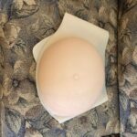 Julie Ann Emery Instagram - The many layers of Nugget. I named my prosthetic belly Nugget before we even started filming. And built into my character a relationship with Nugget. It helped make it real for me that I was moving through the disaster and our world for two. Eventually the Cast and even the Crew also called my belly Nugget. And I like to think that Nugget became real for all of us. Our Costume Designer Debra Hanson did a beautiful job both finding a belly with weight, that hung properly, and then under and over-dressing me in a way that made it feel like an extension of my own body. And bless @goforhugo & @costumegod for continually helping me in, out of, and navigating life for our 6 month shoot with Nugget. Nugget was my continual scene partner. Even in scenes alone on screen, there were two of us there. That fact affected every single moment of the show. So I give you Nugget. All Eps of #FiveDaysAtMemorial Are now up @appletvplus Yes it is intense. But I hope you will give it a watch. It is important for us as a society, and everyone affected by Katrina, victim and survivor alike, deserves for their story to be told and honored.
