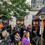 Kathy Najimy Instagram - Walked my smart, funny pal @katiecouric home from a Halloween lunch and we suddenly found ourselves hanging out of a window handing out buckets of candy. I love NYC!