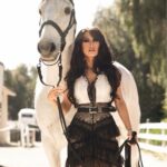 Kerri Kasem Instagram - There were so many great shots from the @fashionmagazinenyc photoshoot, here’s another one! @arezoojalali_photography ⭐️ Thank you to the team: @jbeauty_xoxo - make-up @sky_is_dlimit - stylist @pr_solo - stylehouse @friesiansm - Jardim MT 🐴❤️ @carlossantosdressage - trainer Jardim MT #WesternFashion #Lusitano #Bangs #Ranch