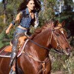 Kerri Kasem Instagram - “Horses lend us the wings we lack.” – Unknown My first horse, Copper Shadow, was a quarter horse that looked just like Bea, the horse in the picture. ❤️🐴 Thank you to the brilliant @arezoojalali_photography! Thank you to the team! @jbeauty_xoxo - make-up @sky_is_dlimit - stylist @declare_denim @wear_the future @tessasilagy - horse 🐎 @friesiansm - Horse coordinator #Cowgirl #DenimAndDiamonds #Quarterhorse #Western
