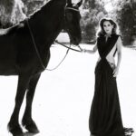 Kerri Kasem Instagram - Love this shot! Taken for @stylecruze magazine by the brilliant @arezoojalali_photography! Make-Up by @makeupnadiya.ca @friesiansm - Heilke @Stello - Dress Collab - @my_cavago #stylecruzemagazine #BlackStallion #HorsesAndFashion #HorseAndRider
