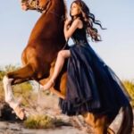 Kerri Kasem Instagram - This Is My World! Traveling the world, riding horses has been a dream come true for me! This shot was taken in Dubai. An amazing collaboration of @my_cavago @portrait.stories and @traveling_shooter_11b! @festimisufiofficial - Gown @fashionweekstudioofficial TY: @grissellehalime 😘 #Dubai #Arabian #Emigrate #richardkruspe #Horse