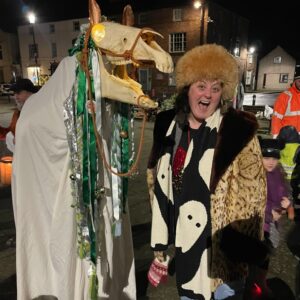 Kiri Pritchard-McLean Instagram - I mean we look so alike in this picture I'm pretty sure Mari Lwyd is my long (faced) lost sister? 
I love that this ancient, Welsh tradition is being revived. It was amazing to see @kristofferdruid lead a celebration of the old Welsh New Year's Eve in Beaumaris last night. The local kids had made calennig and brought them along which was adorable. You know what, considering it was a mob of people stood around singing and dancing and staring at a horse's skull, it was very wholesome.