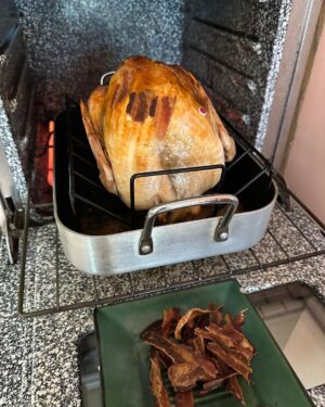 Kirsten Gillibrand Instagram - The turkey is just about done! I cover my turkey in bacon before I cook it - it keeps it super moist and flavorful. Here are my Thanksgiving recipes: 

Thanksgiving Turkey 🦃 

Start with a fresh turkey (if it’s frozen it takes 3 or 4 days to defrost in the refrigerator). Rub the inside cavity with salt. Add 1 apple and 1 onion cut in sections to the cavity for moisture. Put in roasting pan with a cup of water for moisture. Cover entire bird with bacon. Bake at 325 for 20 minutes a pound. Check after 1 hour and remove bacon (so you can eat it!) After the bacon is removed, tent it with aluminum foil so top doesn’t burn. Let rest for 20 minutes when done before you carve it. 

Recipe for Thanksgiving savory stuffing:

Sauté in 2-3 tbs of olive oil (or butter if you prefer):
1 whole large onion sliced 
6 stalks of celery sliced 
2 cups sliced mushrooms 
All to taste:
1 tbs summer savory 
1 tsp sage
1 tsp thyme
1 tsp rosemary
1 tbs parsley flakes
Salt and pepper to taste

Combine sautéed vegetables with 8-12 cups of dried bread cubes (or amount that fits your pan). Add 2-4 cups of turkey broth (if you save giblets from your turkey you can simmer them for an hour and use that broth) until moist but not sticky. Add to a 9x13 greased (butter or olive oil) baking dish and bake for 45 minutes.

Happy Thanksgiving!
