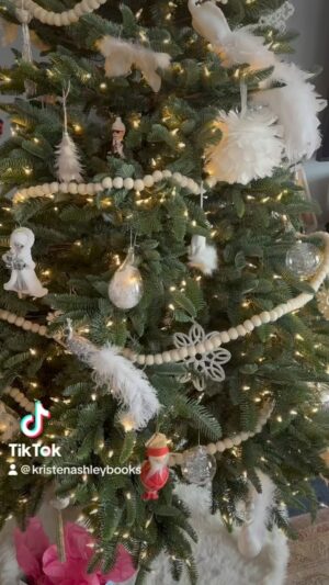 Kristen Ashley Instagram - My tree seemed lackluster this year and I’m hopeless with crafting and decor. But E is genius with it so I went with E to Michael’s and we picked some ribbon and VOILA! I love it! So sparkly and festive! Yay! 🎄🤶🎄🤶 #lifeintherockchicklane