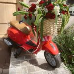 Kristen Bell Instagram - Celebrating @f1 Italy to the MAX. Buckeye meatballs, breakfast pizza and fuel can water. Thank you @redbullracing for the single-seater who took pole position in front of the house. #monza Floral vespa by @erikajaye Linens by @heathertaylorhome Race plates from @bonjourfete