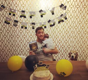 Kyle Greenwood Instagram - Had a very happy birthday and I owe it all to everyone’s best wishes! I learned some new buttons, changed some diapage, had some baby cuddles and a Batman party and I get to wrestle tomorrow on @aewontv life rules so hard! Feelin’ alive at 35!!! There is a sneaky hidden beagle somewhere in this pic drop a 🐶 if you can spot him!