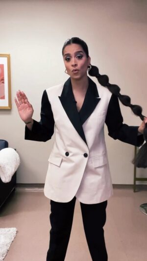 Lilly Singh Instagram - 20 outfits for 20 episodes of trivia! The series premiere of @battleofthegenerations happens TONIGHT at 9pm et/pt on @ctv, executive produced by my very own @unicornisland. Monday nights are about to get a whole lot more fun! (Omg a throwback? New episodes every Monday… 🥹)

This is the hottest new pop culture trivia show that features one contestant from every generation. It’s Gen Z vs. Millennial vs. Gen X vs. Boomer, all battling for their chance to win up to $25k baby!! 

Think you know your stuff? Play along with us! It’s silly, it’s goofy, it’s intense and it’s happening tonight!! And I have the honour of being your host! 

Comment below with which generation you think is winning episode 1! 👇🏽

PS: you know the hustle is real when you shoot an outfit transition everyday after shooting for 20 days, trying not to move the phone 😅😅 izzzz contentt 🤌🏽