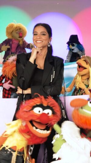 Lilly Singh Instagram - This Desi girl has entered The Muppets franchise!💥 This is the crossover I never knew was possible, but life is about creating the things you wish existed!

Our new series @themuppetsmayhem is streaming internationally May 10 only on @disneyplus. Mark your calendars! 🗓️ 

I have the pleasure of playing Nora Singh, a music exec that is trying to help @electricmayhemband record their first album. And it turns into a WILD ride. I can’t wait for you to see it! 

So strap in! It’s about to be MAYHEM! 🎸 🥁 BRUAHHHHH!!

#TheMuppetsMayhem #DesiGirl 

More to come. Keep watching this space 😉