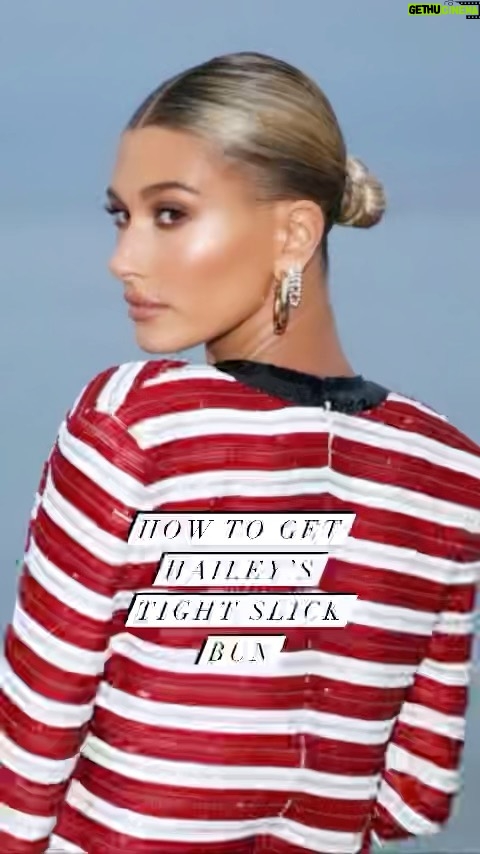 Liz Trinnear Instagram - Hailey Bieber sleek bun tutorial ✨ . . This is my default hairstyle these days because a) it’s so easy b) looks cute c) takes under 5 mins. My good pal @matthewstylist taught me the hot tip on using a beard brush which is a game changer for smoothing. You can do this style with wet or dry hair. Jazz it up or keep it simple! Have a bun time! 😂😘 #slickbun #sleekbun #hairtutorial #haileybieber #howto #hair