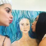 Lucy Fry Instagram - Here is other side! 🌞🌛 I’ve loved how posting this painting has brought up the memories of all the friends who have been there with me in its many stages. Sometimes even hanging out and chatting while I was painting. It feels communal, and i had forgotten about the warmth of that until I shared it this week. In a lot of ways, it was scary and lonely to start this painting. I was 22, and I hadn’t been to any art classes then so I didn’t know anatomical drawing. But I wanted a creative way to overcome body dysmorphia and to look at myself more kindly. So I started off by measuring my proportions with a tape measure, and painting my body onto the canvas at scale. It circumvented the eye trickery. But once the outline was down, the figure came out in pale grey tones, with her eyes closed, and was unintentionally corpse like. And then I found myself painting weeds growing out of her stomach, everywhere, taking over the whole canvas. It was easier to paint weeds than to really look. I was very frustrated and the canvas loomed in dusty corners for years. I was 26 when I finally opened her eyes and painted warm color into her cheeks and flesh. It took another few years to figure out her context, to give her feet grounding and her hands flowers. A sun and a moon. A place to be. I love that sharing it now has brought the warmth of community around this process into focus. Especially all the friends who were there with me in the awkward phases. I love you! It’s helped this painting come to a place where I feel the love in it. Thank you all for being so encouraging about the creative process! 💛