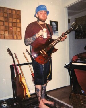 Mac Miller Instagram - This is a photo of me adding the last piece of music to the album. Swimming is available now. Link in bio.
