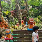 Mai Hakase Instagram - 名護パイナップルパーク🍍 暑さが苦手な息子は、 パイナップル畑をトゥクトゥク🛺に乗って進んだり、植物園をまわるのも暑すぎてずっとぐったりで無表情でした😅涼しいところでパイナップルかき氷食べるのと恐竜エリアだけはテンションが上がってました😂 #名護パイナップルパーク #nagopineapplepark #나고파인애플파크 名護パイナップルワイナリー