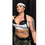 Maria Spiro Instagram - I did it for the fans I knew I would have in the future. The ones that could then look back... look at what it took to get me here. The blood I shed is for you. It’s not for the internet..the internet is a big world. Filled with those that are watching, either because they love it and live through it.. or you watch it because you’re just laughing at how pathetic I am with my stupid tattoo that I’ll regret in 10 years... I look like a man, too, right? Cause I’ve got bigger arms then your boyfriend? My body is not built to flex cute for Instagram on Friday night..my body is built to fucking survive. Not just in the wrestling ring.. in LIFE. It’s funny how peoples true colors come out over the years ..it’s like blindly dressing up as a clown and seeing who laughs and ignores. Well what you laugh at, is real. It’s life. It’s my journey.. what it took to get me here, and the view I know I will see at the end. You see, in a normal script, the female is put into the role of the good guy .. the hero.. the Wonder Woman.. the one that only fights for good... but what if she decided she wants to flip the script halfway through the movie.. could she do that though..? Oh wait, this is real life... there’s no script? Oh yeah you’re right, I can do whatever I want. I can be the bad guy and still save the world with my pigtails and lipgloss when a female needs to be saved from her own reality. This is my script.. I write it. There’s two types of people... those that watch a movie and root for the hero... and those that sympathize with the crazy killer. Are we wrong for feeling that way? Are we in some sort of trouble.. because our natural instinct is to side with the bad instead of the good? No, your perfectly normal for having any thought in your head. It’s those that act upon those thoughts, whom are the craziest. Most people just wanna watch the movie... some are even willing to rein-act movie type scenes and fights for entertainment.. the market is clearly doing very well for itself. But remember, even the actors in Hollywood movies have to get inspiration somewhere. These things fucking happen. Some survive and some don’t. I’m still here, I’m s