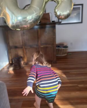Mary Katharine Ham Instagram - This gal turned two! For those keeping count, that means we had two under two… for 9.5 months. And we’re still standing! A lot of the credit for that goes to Holly, who much like her father, has a GIANT personality and also loves a schedule. That means she sleeps. Hallelujah, can that girl sleep, from 6pm-7am, in the same room as her brother. 

When we say “bedtime for baby?” after two episodes of “Bluey,” our girl marches herself up the stairs to get her zzzzs. “Bye, guys! Bye, guys! Bye, Guggy!” (this is either doggie or Garnet, we’re not sure which) She is a woman of few words.

She says “Dad” constantly, “wow” and “Scout” and “stop” and “don’t,” usually to her bro. She has a long-running joke where I ask her to say “Mama,” and she mouths it without actually saying anything and then laughs because, let’s face it, that’s funny. But she resorts to “Mama” when she’s very sad, which isn’t often.

She is good-natured and very physical. The other day, I told her to say “please,” and I would lift her over the couch, and she was stubborn about “please” and simply hoisted herself over the couch with a ridiculous display of brute upper body strength.

She is newly into books, but her brute strength makes her the first kid I’ve ever had capable of destroying board books. She might be the most problem-solving kid I’ve had. She untied, collapsed and removed the tent pole from her little play tent in the living room while I wasn’t looking the other day, then uncollapsed it to hold up in front of me. (Meanwhile, her brother is already saying “bottle” in an effort to defend himself against her when she steals his bottle, which is often).

Watching her play is a bit like watching the velociraptors test the fences. “Clever girl.” She loves to clean (also gets that from Dad), brings her own diapers for diaper changes and throws the dirty ones away. She’s just started doing “big hugs” and will hug you and sigh and pat you on the back. Sings along with “Daniel Tiger” and loves cheese, ham, and anything I’m eating. 

She has made a lot of our lives possible the last 9 months by just being her and, boy, do we love her! Can’t wait to see her grow!