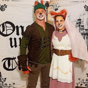 Mary Katharine Ham Instagram - Costume szn is here. Steve and I had a legit argument about how best to affix the fox ears from a slutty fox costume to a Robin Hood hat and how to make an arrow out of a chop stick and some old peacock feathers and tin foil. But as you can see from Pic 2, the hat and arrow construction are solid. We arrived too late to be voted on for the costume contest and I’m kicking myself. That’ll teach me to be late to the party! I know this era of Disney isn’t supposed to be good, according to the critics and stuff, but I’ve always loved this movie. Maybe it’s the country crooner rooster.