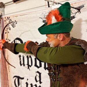 Mary Katharine Ham Instagram - Costume szn is here. Steve and I had a legit argument about how best to affix the fox ears from a slutty fox costume to a Robin Hood hat and how to make an arrow out of a chop stick and some old peacock feathers and tin foil. But as you can see from Pic 2, the hat and arrow construction are solid. We arrived too late to be voted on for the costume contest and I’m kicking myself. That’ll teach me to be late to the party! I know this era of Disney isn’t supposed to be good, according to the critics and stuff, but I’ve always loved this movie. Maybe it’s the country crooner rooster.