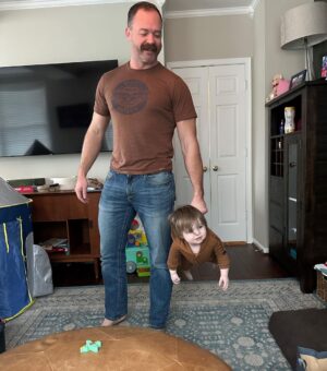 Mary Katharine Ham Instagram - We are super thankful for this guy, who is among the most active and involved dads there is! We test his capacity for executive function and dedication daily, but he always comes through, rarely missing leg day, looking great in bunny ears and other costumes, and literally never forgetting to take out the trash. Really, it’s kind of amazing! The kids have learned so much from him, making them independent and self-sufficient in ways beyond their years. (The 18-month-old brings diapers and wipes, puts them back where they belong after diaper changes, and throws her dirty diapers in the trash.) It’s nearly impossible to get a pic of him with all four kids because it turns out having four kids involves a lot of passing them back and forth to each other in configurations of 2-and-2 or 3-and-1, but he is always there for all of them and for me. We love him and are lucky to have him! 💙🧔🏻‍♂️👩🏻👱🏻‍♀️👱🏼‍♀️👧🏼👶🏻🐺