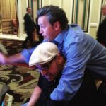 Matthew Perry Instagram - Me climbing on my friend Roger at a slot machine. What happens in Vegas, gets posted on Instagram. #tbt