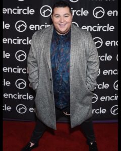 Max Talisman Instagram - Encircle’s Queer Holiday Party 🎁🏳️‍🌈 Styling by @styledbyambika Grooming by @robertti Shirt by @robertgrahamnyc Jacket by @johnnybiggusa Haircut & Styling by @hairbyrmz and @southpawlosangeles E.P & L.P