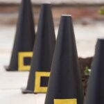 Meaghan B. Murphy Instagram - The witch is in! 🧙🚨HALLOWEEN DIY CONES How to: 🎨 Spray paint safety cones black 🧙 Cut buckles out of adhesive glitter paper; stick on. 👻 Line your walkway #halloween #witch #thewitchisin #halloweendecor #halloweencraft #halloweencrafts Halloween Headquarters