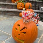 Meaghan B. Murphy Instagram - Punk is not dead! ☠️🍭 This punk-in 🎃 doubles as a candy dispenser for trick-or-treaters! 👻 #pumpkinseason #pumpkins #pumpkin #pumpkincarving #punk #punkrock #lollipop #lollipops #halloweendecor Halloween Headquarters
