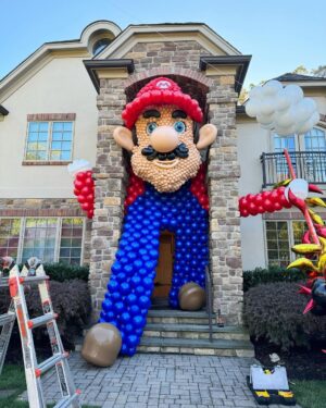 Meaghan B. Murphy Instagram - Mamma Mia! My fully charged friend ⚡️Danielle (p. 177 of YFCL) + @dreamfactoryballoons 🎈have outdone themselves once again to raise $ and awareness for @crohnscolitisfoundation_nj 

For the 10th year, friends and neighbors are invited to tour the balloon fantasy land, spin the wheel, win a prize & make a donation for the Crohn's and Colitus Foundation. Danielle started the tradition as a way of coping after their 9-year-old was diagnosed with the disease. I celebrate + admire her for channeling pain into purpose. It feels good to do good! Click the donation button to give back.

And in case you were wondering, my last-minute costume = French Kiss! Get it: Beret + Kiss concert tee!

#balloonart #balloons #halloween #crohnsandcolitis
#bestfieldnj #kiss #mariobrothers