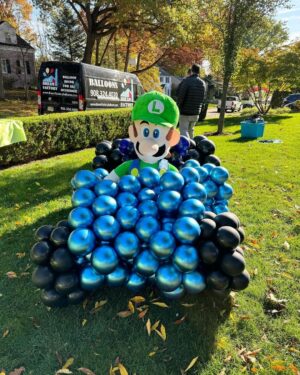 Meaghan B. Murphy Instagram - Mamma Mia! My fully charged friend ⚡️Danielle (p. 177 of YFCL) + @dreamfactoryballoons 🎈have outdone themselves once again to raise $ and awareness for @crohnscolitisfoundation_nj 

For the 10th year, friends and neighbors are invited to tour the balloon fantasy land, spin the wheel, win a prize & make a donation for the Crohn's and Colitus Foundation. Danielle started the tradition as a way of coping after their 9-year-old was diagnosed with the disease. I celebrate + admire her for channeling pain into purpose. It feels good to do good! Click the donation button to give back.

And in case you were wondering, my last-minute costume = French Kiss! Get it: Beret + Kiss concert tee!

#balloonart #balloons #halloween #crohnsandcolitis
#bestfieldnj #kiss #mariobrothers