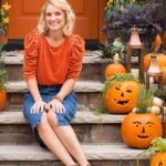 Meaghan B. Murphy Instagram - Pick my Halloween 🎃 headshots 📸: A. Awkwardly holding a pumpkin B. Aggressively putting my thumbs in my pockets C. Chillin’ on the stoop in a denim jumpsuit that is cute until you have to pee D. Hands on your knees, hands on your knees—isn’t that from a party song?!? #halloween #halloweenheadquarters #headshots #editorsletter #halloweenqueen #headshot Halloween Headquarters