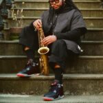 Michael Jordan Instagram - It’s the Brooklyn way 💯 Photographer and filmmaker @satchellee takes us back to her father’s stomping grounds for the 35th anniversary of the AJ4, featuring the new ‘Bred Reimagined’ silhouette and saxophonist @immanuel.wilkins. Link in bio to get notified. Brooklyn, New York