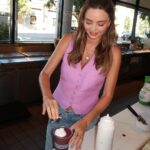Miranda Kerr Instagram – I can’t believe it’s finally here!! Introducing my KORA Glow Smoothie 💜 We’re celebrating the launch of our @koraorganics Plant Stem Cell Retinol Alternative Moisturizer all month long with our friends at @erewhonmarket! We might be biased, but my baby and I think it’s the best smoothie we’ve ever had 😉🤰🏻

We included some of my favourite skin-loving and pregnancy safe ingredients inspired by the age defying range:

🌱 Organic @SAMBAZON Unsweetened Açaí Superfruit Packs 

🌱 @CopinaCo Vanilla Plant-Based Collagen Boost

🌱 @Cocojune_organic Pure Coconut

🌱 @CalifiaFarms Organic Almond Milk
 
+ so many more!

All net proceeds go to @OrganicFarmingResearch in support of educating & empowering sustainable organic harvesting practices 🌾
