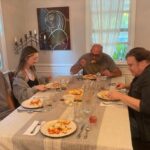Mo Collins Instagram - Saturday night family din-din. Alex made a DELICIOUS lasagna!! ❤️ @hanaskuby Garreth, and Uncle Billy @thewilliambutler @skubyballs
