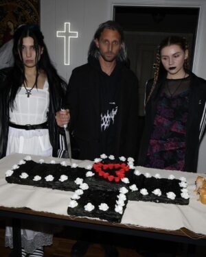 Nadezhda Tolokonnikova Instagram - 💒🔪🫀💍 и умерли в один день x @vegsurfer 

@nytimes 📝: Nathan Monk, a priest who left the Russian Orthodox Church because he did not support its stance on gay marriage, led a ceremony.

Ms. Tolokonnikova’s daughter @gerariot made the party’s playlist, which featured Soviet pop and contemporary Russian trap. For food, Ms. Tolokonnikova suggested serving pickles and vodka, but Mr. Caldwell insisted on something more robust.

Ms. Tolokonnikova baked a large vegan Napoleon cake, dyed it black and assembled it in the shape of a cross, a symbol she uses often in her artwork.

The dress code was “gopnik,” a word that encapsulates a style of dress, music and art reflecting the working class in the former Soviet states in the 1980s and 1990s. 

Guests showed up in tracksuits, house slippers, Adidas slides and newsboy caps, and one brought an accordion. 

Photos: @thecobrasnake 
Article: @vsaffron 
Priest: @fathernathan