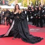 Nadine Njeim Instagram - I have always been fascinated by the glamour of the 50s era. The era of Brigitte Bardot and Sofia Loren.… You know, I love how back then, women embraced their curves, fashion was bold, yet feminine… And here we are today… Zuhair and I decided to create a custom made dress inspired by this golden Era and this magical city… Cannes… Thank you for every person who made this vision come to life… Thank you @chopard for hosting me 🤍🖤