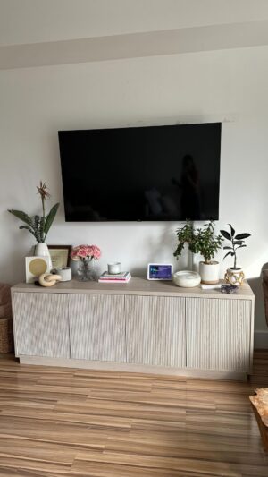 Natalie Negrotti Instagram - I finally got my 1st tv at 33 y/o! 🥹 My best friend of 15 years came over to install it for me and I AM SO FKING HAPPY! What r some of your firsts this year?

I always tell him all the crazy things in my brain so today I taught him about dating apps because he had no idea about them. I also mooch off his Netflix account and made his algorithm gay 🤣 I’m in my villain era 

P.S. Brian isn’t gay he’s straight I just watch gay and lezzie shows and turned his algorithm gay 🙃

P.S. again… I also got my first dog at 33 isn’t he soooooo cuteeee