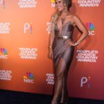 Natalie Stovall Instagram - First ever @peopleschoice Country Awards!! 💋👏🏻🎙️ HMU: @therealmarzcollins Assistant HMU: @alishapag Styled by: @juliandjeri @thejeristyles Jewelry: @willajeanjewelry Dress: @michaelcostello Shoes: @jimmychoo Belt: @restyled.by.Juli