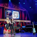 Natalie Stovall Instagram - 🌟TONIGHT🌟 on the @opry 🎙️We relive the magic of @ashleymcbryde ‘s induction night. Country icon @terriclarkmusic did the honors, @jossstone had her debut and as ALWAYS Ashley was the stunning, honest, incredible shining star that makes us all proud to be part of the country music community. Tune in on @circleallaccess 9/8C or watch the livestreams on Circle’s FB or YouTube feeds! 🤍🌟 #oprylive Grand Ole Opry
