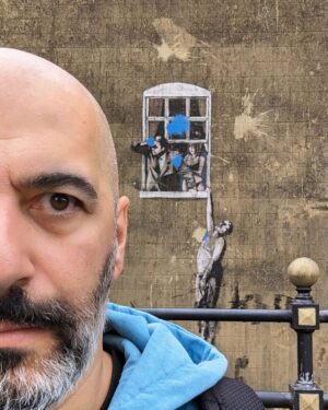 Nima Akbarpour Instagram - Well Hung Lover, also called Naked Man Hanging From Window is a mural by the anonymous street artist #Banksy, on a wall in Frogmore Street, #Bristol, #England.
