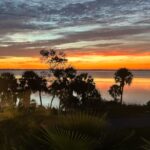 Norah Casey Instagram - My last sunrise at #portcanaveral and it’s a spectacular one from this side of the Atlantic Ocean… yesterday I listened to a seasoned #nasaastronaut who’s been way up there on multiple space trips - he reminded me that the International Space Station orbits Earth about every 90 minutes—enough for astronauts to witness 16 sunrises and 16 sunsets each day… wow - that must be something. I’m happier down here on earth witnessing my daily ritual of our own sun rising but a day with my head in the vast universe of our galaxy and the gazillions beyond at the #kennedyspacecenter made me think a lot about life and our tiny little corner in the #milkywaygalaxy … but I didn’t feel small, I felt privileged to wake up each morning and witness our sun rise on a brand new day… full of all the possibilities that life brings. And this morning it was like an extra special gift with big brushstrokes of crimson, pinks yellows and blues 💚 Kennedy Space Center