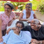 Nore Davis Instagram - Every stage in her life that iconic smile stayed consistent. Quick tap in before I continue co-creating & executive producing (EP) my mother’s RIP Preimere & Ceremony… Thank you to my friends, family, comedy community and fans for the out pour of love and Venmo donations. My heart is overwhelmed. Finally was able to unlock her laptop and contact all her friends. Unfortunately, not her iPhone because it’s security locked forever. In her last days she couldn't remember her passcode which is my birthday and my brother’s birthday combined. (1011) that make me cry everytime. I learned so much about death when she was in the hospice. She was in there for only 3 weeks but to me it felt like 3 months. It's like watching a lightbulb in your kitchen flicker on and off before it finally goes out. One thing about my mom she kept her radiate and signature smile all the way up to her last flicker. I love you mommy and I'm so sorry cancer did this to you. I know you didn’t want to go and I didn’t either. All my brother and I could do was put more time on your clock before your championship game was over. *wipes tears from face* Okay, to my new followers, thank you for coming to this page. My 5th stand-up comedy album just dropped and I promise once I get through this painful grieving stages in my life, I'll be back to the funny! Trust me, I'm hurting but there is so much comedy I'm witnessing at this time like y’all know my mom's ex-boyfriend hit me up from hearing the news? He texted me “Oh so sorry to hear about Jackie. We were GOOD friends. Call me back when you can” I'm like Ewww & no nigga! I’m #TeamKDavis (my dad) all day! Blocked. Lmfaoooo Anyway, like Jay-Z NEVER said “I can see it coming down my eyes so I gotta make this post cry.” ✌🏾🥹❤️ #fuckcancer