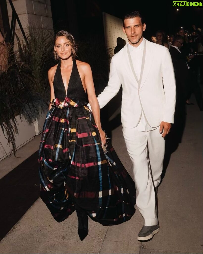 Olivia Palermo Instagram - His & Hers Armani 👩🏼‍❤️‍👨🏻 In vintage @giorgioarmani Privé Spring 2013 and new @stuartweitzman boots for #GAonenightonlyVenezia 👗👢 💄: @sam_tsan for @charlottetilbury 💇🏼‍♀️: @marcoromanohairartist Venice, Italy