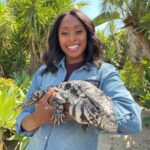 Rae Wynn-Grant Instagram - It’s been over 1 month since we announced the return of the iconic show @wildkingdomtv & my role as the newest co-host. It still feels surreal, except when i’m huffing & puffing, sweating profusely on camera and avoiding wild animal bites. As a trained biologist, I’m able to get up close & personal with many of these animals, but please don’t do this at home 1: Argentinian Tegu 2: Press Release Day 3: No spoilers but trust me it’s GOOD 4: A different type of surreal feeling 💅🏾 5: The hardest working crew 6: The man, the myth, the legend, my co-host and new bff @peterwgros 7: Episode 1 wrap 🎬 8: The original show that inspired my career
