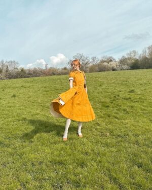 Rebecca Flint Instagram - Spring’s first light filling the pages with shimmering delight ☀️ 

Feeling very little women, in my @sondeflor classic short sleeve dress in marigold 🌻 
 
made from 100% locally sourced Lithuanian linen and free shipping right now 😊

#thisjaneaustenlife #ofwhimsicalmoments #fairycore #cottagefairy #asecondofwhimsey #wherefairiesdwell #theheartofslowliving #softcore #coquetteaesthetic #parisiennegirl #thatvelvetfeeling #dreaminginpictures #amomentofwonder #ofquietmoments #whimsicalwonderfulwild #meadowcore #gardencore #warmcore #vintagecore #aseasonalshift #embracingtheseasons #quietchaotics #naturecore #lafemmeparisienne #monlook #onparledemode #romanticstyle #softgirlaesthetic #fashionhistory #springoutfitideas