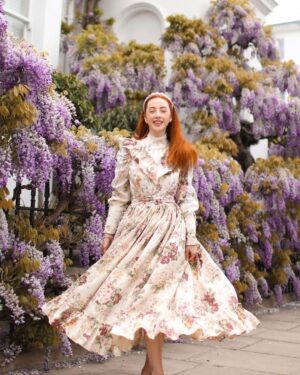 Rebecca Flint Instagram - There’s no greater thrill than wearing clothes you have sewn yourself 👗💃⁣
⁣
A few weeks ago I decided to finally make use of an old pair of vintage floral curtains 🏡⁣
⁣
Heavily inspired by 70s Prairie dresses, in particular, vintage Laura Ashley, this dress features a standing collar, lace detailed yoke with frill, leg-of-mutton sleeves with lace panels and pearl buttons, and a mighty skirt which holds more than 5 metres of length 😱⁣
⁣
There’s still things I would try and improve on if I could sew it all over again, but I’m focussing on enjoying the fruits of my labour and the peace I had when sewing it 🧘‍♀️⁣
⁣
If you sew too - tell me - do you always have the fear that for some reason it’s all going to fall apart as soon as you leave the house and be left bare? Tell me I am not alone! 🫢⁣
⁣
Thank you to @hellomissjordan for a gorgeous day out, and for helping take these photos 🌸
