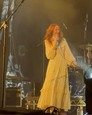 Rebecca Flint Instagram - ✨10 years of All The Lights In The Sky✨

Being a featured artist on @area11 incredible album all those years ago was such an honour, and earlier this year it was even more of a privilege to join them on stage to sing our song together Shi No Barado in London for their tour 🎤 !!

This was a huge test for my confidence but I was so proud and pleased to be able to do it plus I had my friends supporting at my side! 🫶 and an amazing crowd singing all the words with me 😭

I’ll be joining them again THIS SATURDAY in Leeds 📍 @area11 for the last tickets left! 🌌
