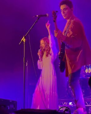 Rebecca Flint Instagram - ✨10 years of All The Lights In The Sky✨

Being a featured artist on @area11 incredible album all those years ago was such an honour, and earlier this year it was even more of a privilege to join them on stage to sing our song together Shi No Barado in London for their tour 🎤 !!

This was a huge test for my confidence but I was so proud and pleased to be able to do it plus I had my friends supporting at my side! 🫶 and an amazing crowd singing all the words with me 😭

I’ll be joining them again THIS SATURDAY in Leeds 📍 @area11 for the last tickets left! 🌌